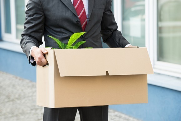 Man carrying box after losing job