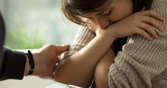 Woman being comforted