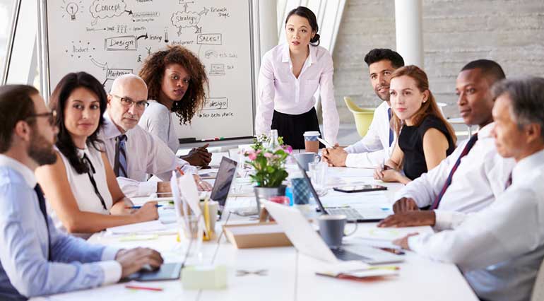 Woman leading a board meeting