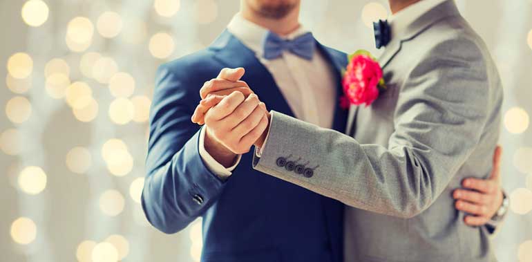 Two grooms dancing