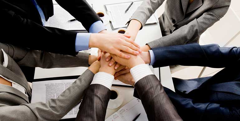 Business people hands in working together