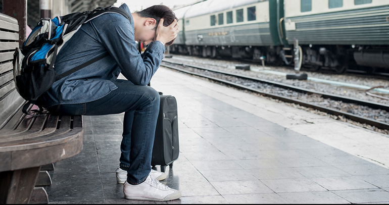 Young Unemployed person in train station