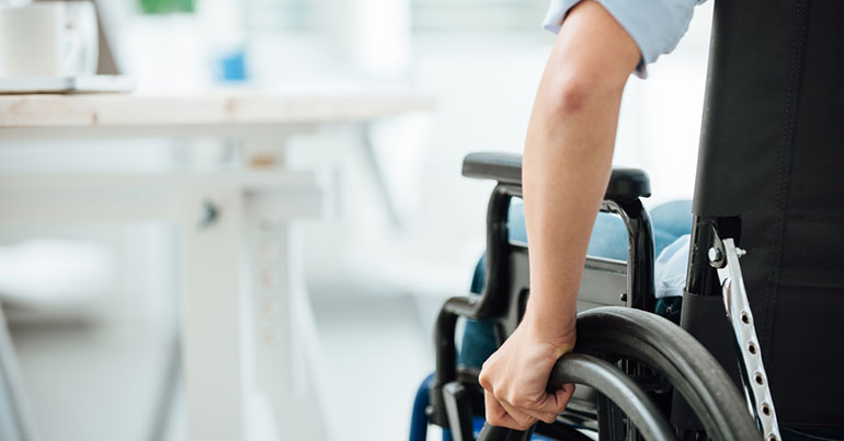 person with a wheelchair in the office