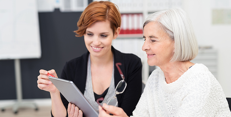 Younger colleague trains older worker