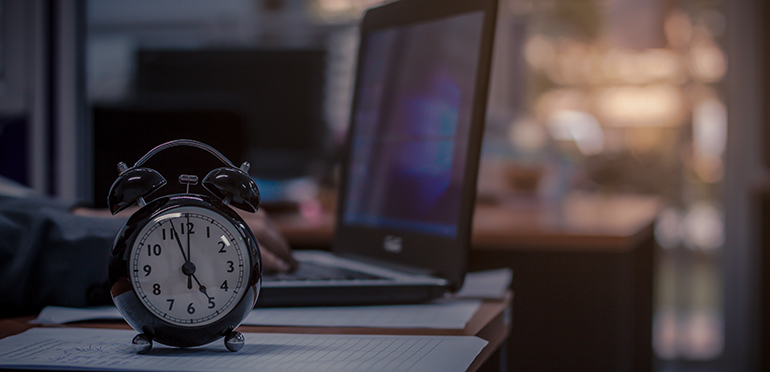 Man staying late at his desk