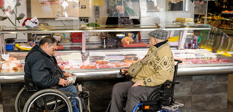 men in wheelchairs at deli