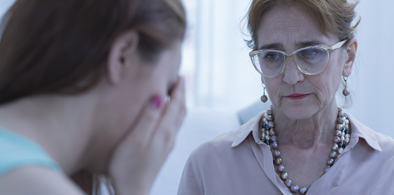 Woman speaking with a counsellor