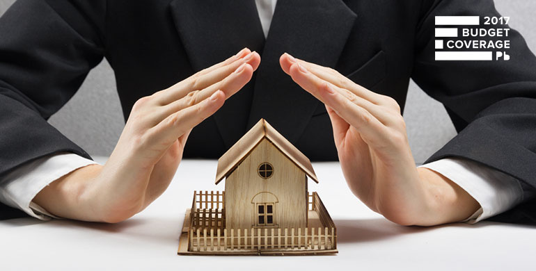 businesswoman with model house