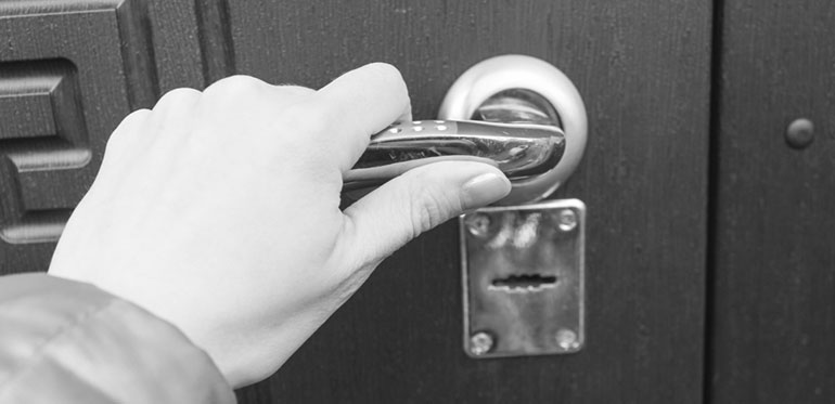 Woman shutting door