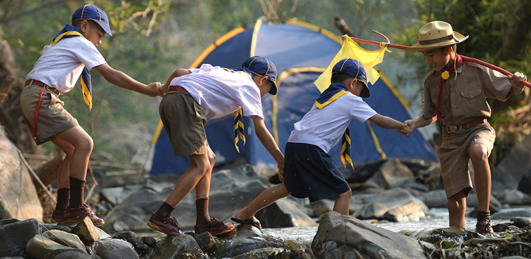 scouts crossing a river