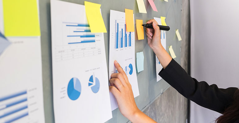 Woman planning on blackboard