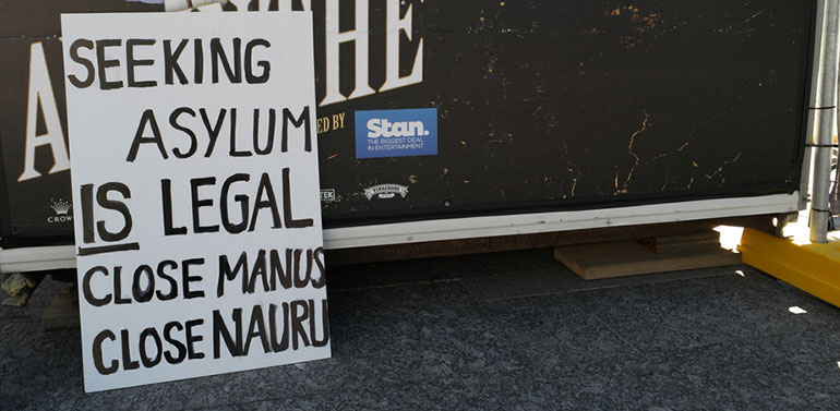 Asylum seeker protest sign