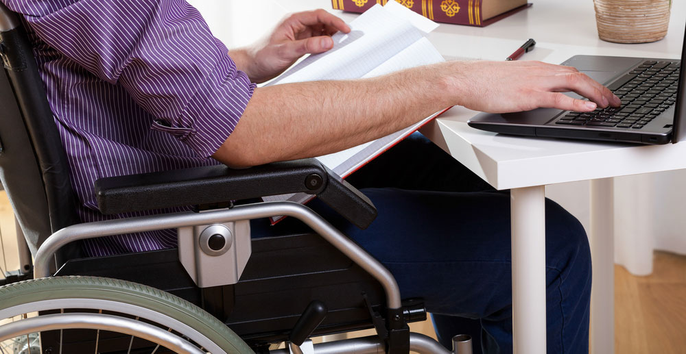 Man in wheelchair at work