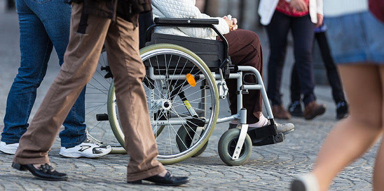 Wheelchair in a crowd