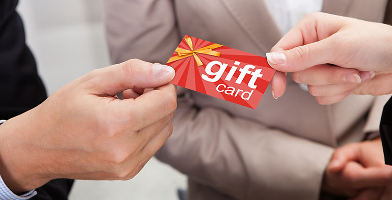 Person giving a gift card