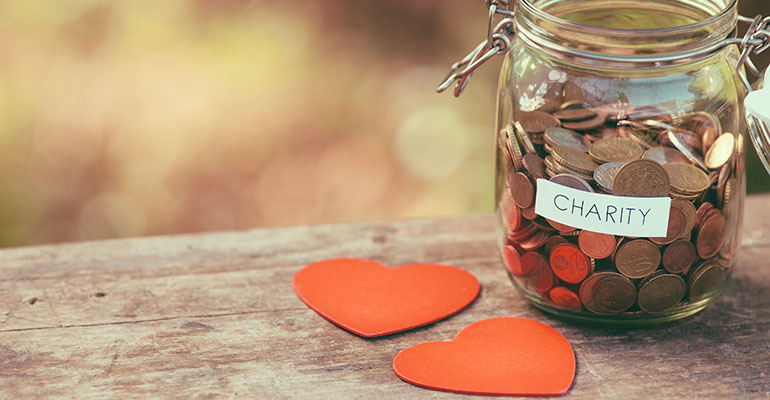 Charity jar filled with coins