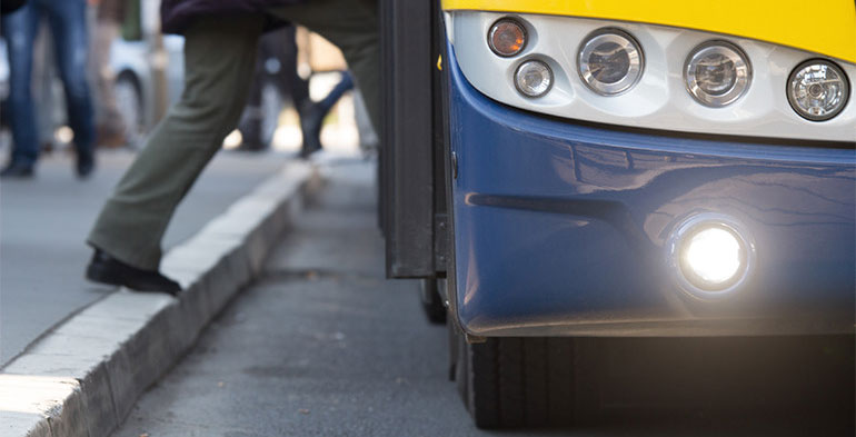 Woman getting on a bus