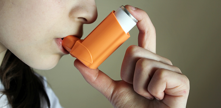 person with an inhaler