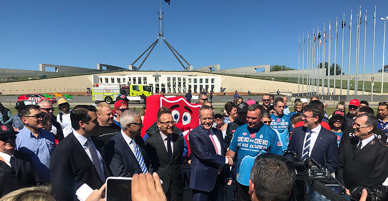 Bill Shorten and Brendan Nottle shake hands outside Parliament House