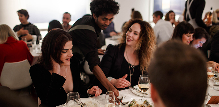 waiter serving diners