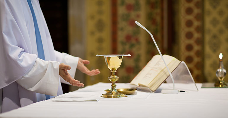 Priest giving mass