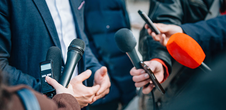 press interviewing business man