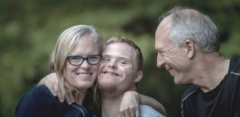 Man with a disability hugging a lady