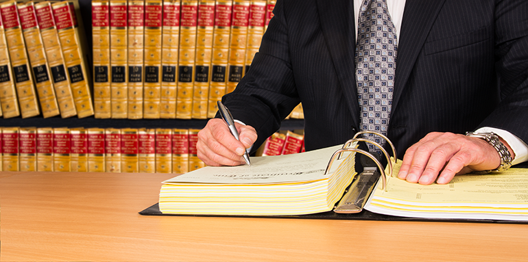 man reading legal documents