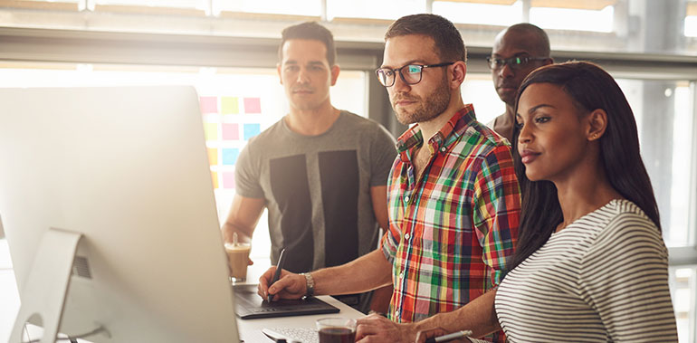 Entrepreneurs at a computer