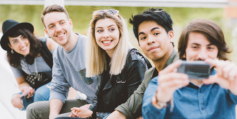 group of young people taking a selfie