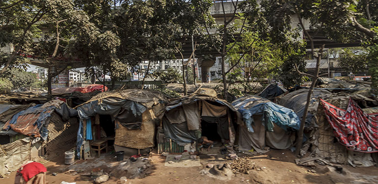 People live in slums just off the tracks in Dhaka Bangladesh