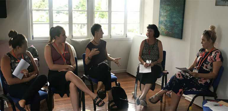 Group of women sitting having a discussion