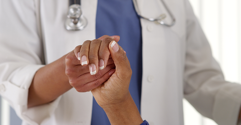 Doctor helping patient