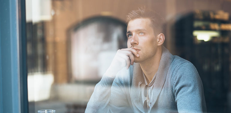 man dreaming through window