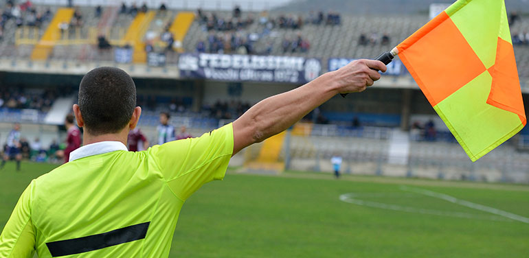 umpire waving a flag