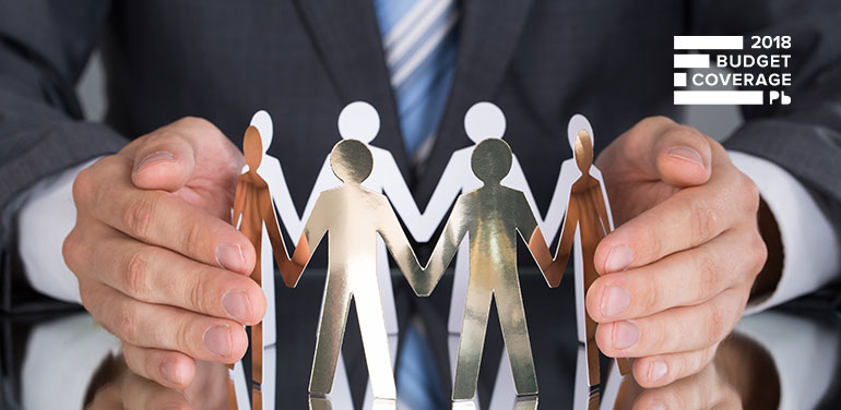 Man in a suit holding chain of people cut out of paper