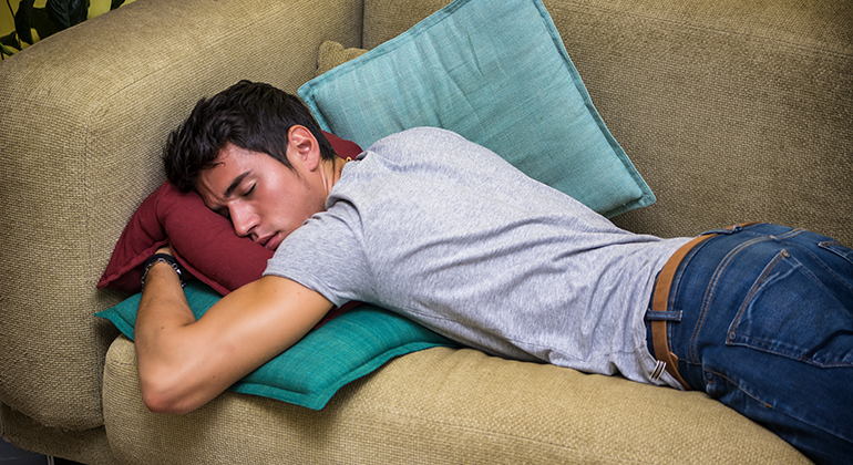 man sleeping on the couch