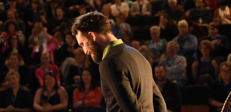 Speaker on stage at Storyology in 2017.