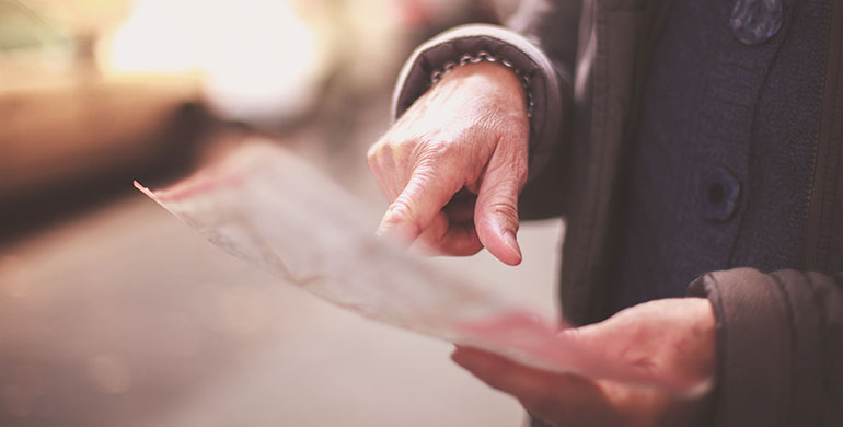 Person pointing at a map