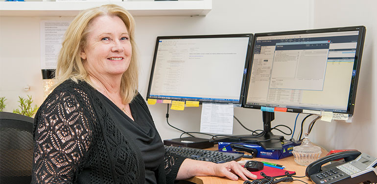 Woman sitting at her desk