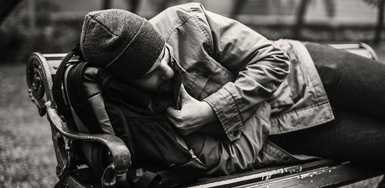 Man sleeping on a bench