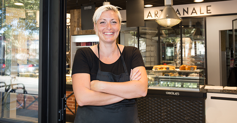 business owner outside cafe