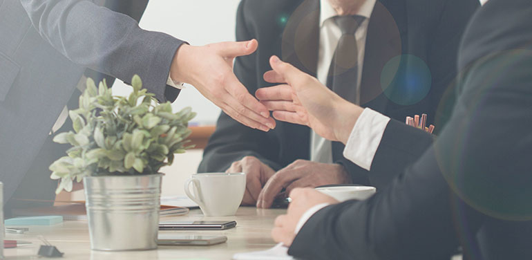 Men in Suits on shaking hands