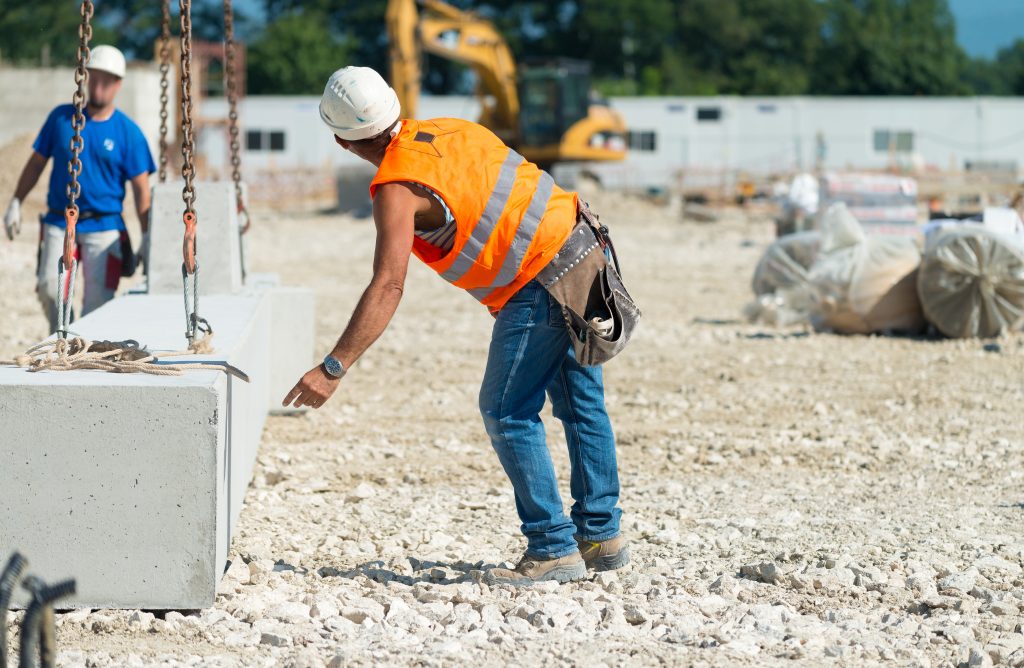 Workers operating in contruction building site