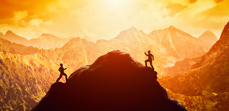 people racing to the top of a mountain