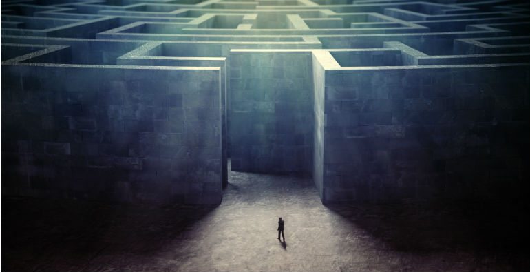 A tiny person entering a maze