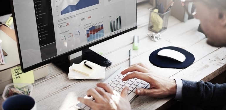 Businessman looking at data on computer