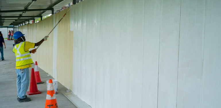 Workers painting the walls.