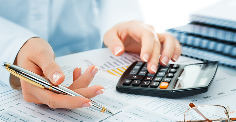 hands next to calculator