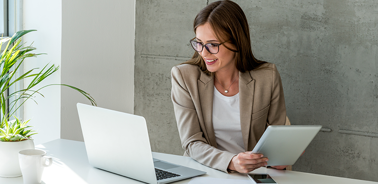 woman sitting at desk on laptop